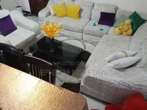 L-Shaped Sofa Set With Centered Table and Cushions and Center Table