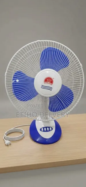 The Image Shows a Shape Crown Table Fan Ventilator (Green and White Mo