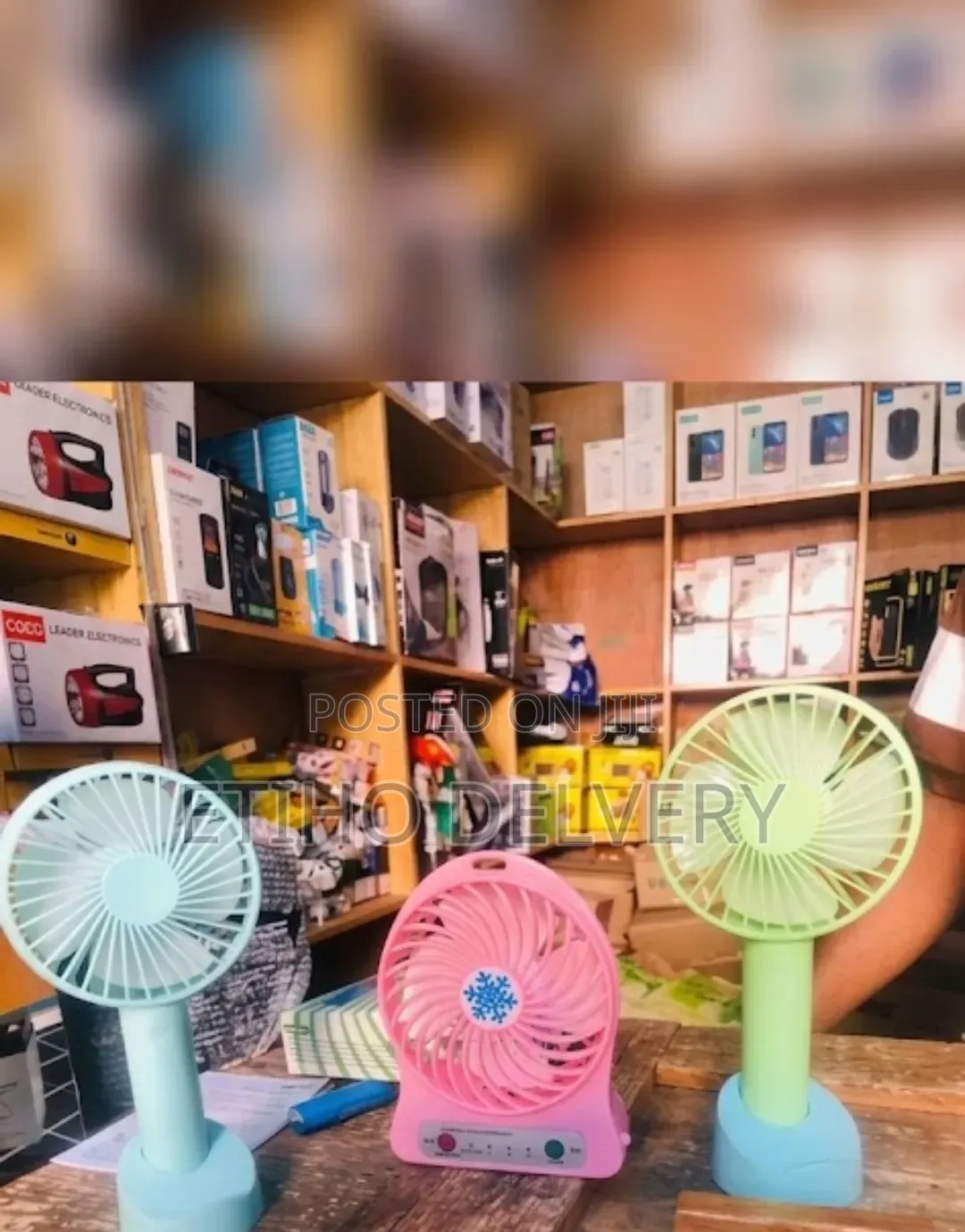 A Portable, Rechargeable Mini Handheld Fan With a Detachable Base And