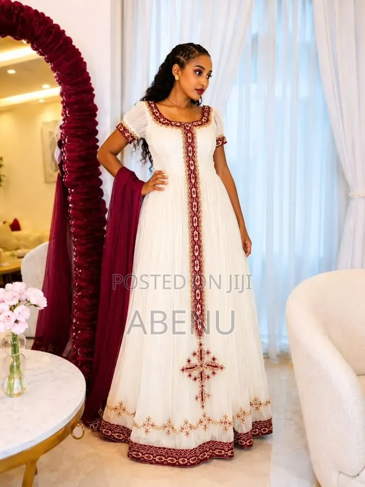 Elegant White Habesha Kemis With Gold and Purple Embroidery