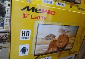 The Image Shows a Box for a MeWe 32-Inch LED TV With a Double Glass Sc