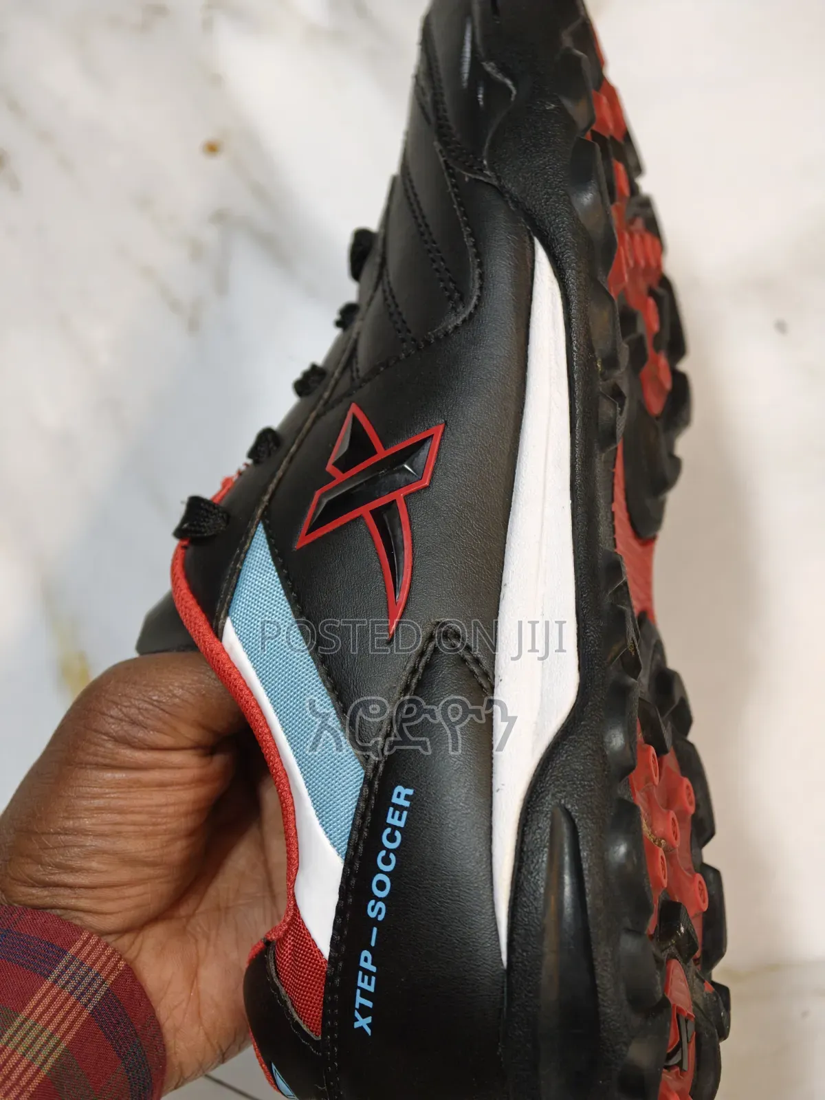 Football Shoe ታኬታ