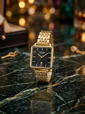 HERMES Gold-Tone Stainless Steel Bracelet, a Square Black Sunray Dial