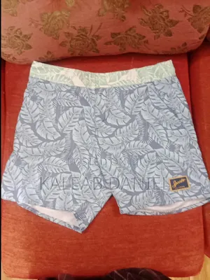 Swim Shorts Short Blue-Gray Swim Trunks With a Tropical Leaf Print