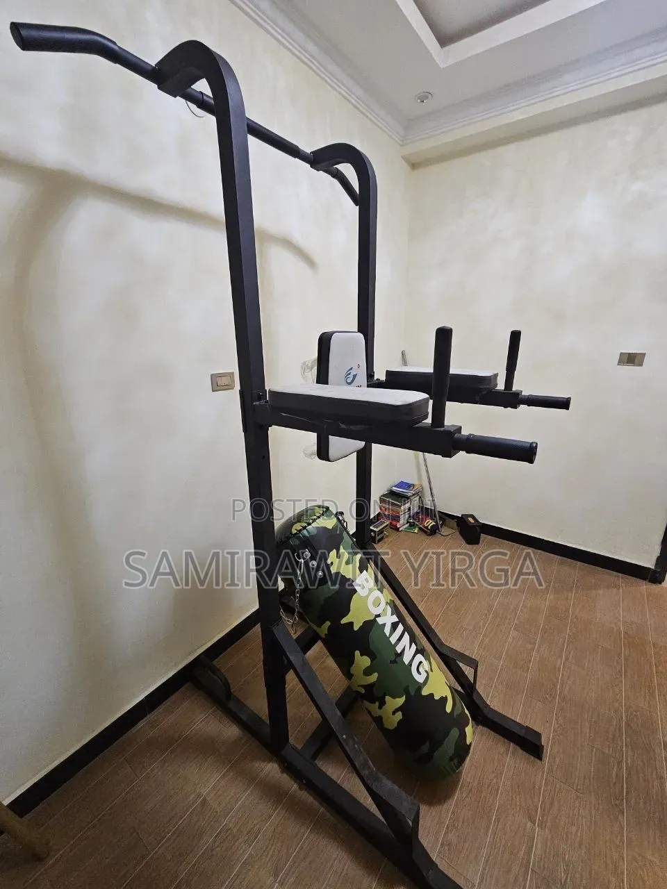 Hui Jun Power Tower With an Added Punching Bag