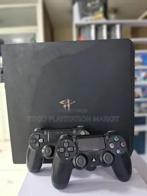 PS4 Slim With Two Black Controllers. 