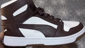 PUMA Rebound Layup RCL Mid-Top Sneaker in the Chocolate Brown–PUMA.