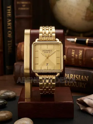 Gold-Tone Analog Wristwatch Featuring a Square Case Matching Gold Dial