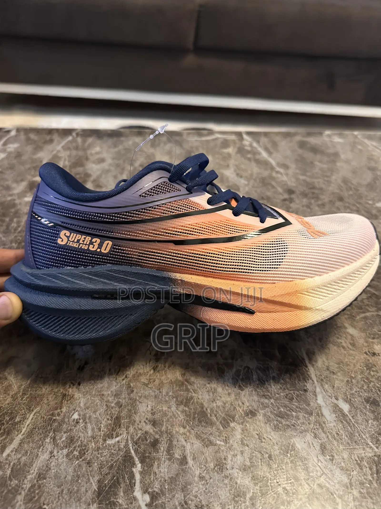 “Super Strike Pro 3.0.”. Breathable Mesh. Navy Blue and Peach/Orange