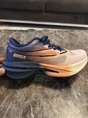 “Super Strike Pro 3.0.”. Breathable Mesh. Navy Blue and Peach/Orange