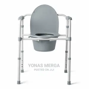 Photo - Adjustable-Height Commode Chair Foldable
