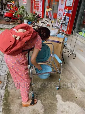 Photo - Folding Commode Chair With Wheel
