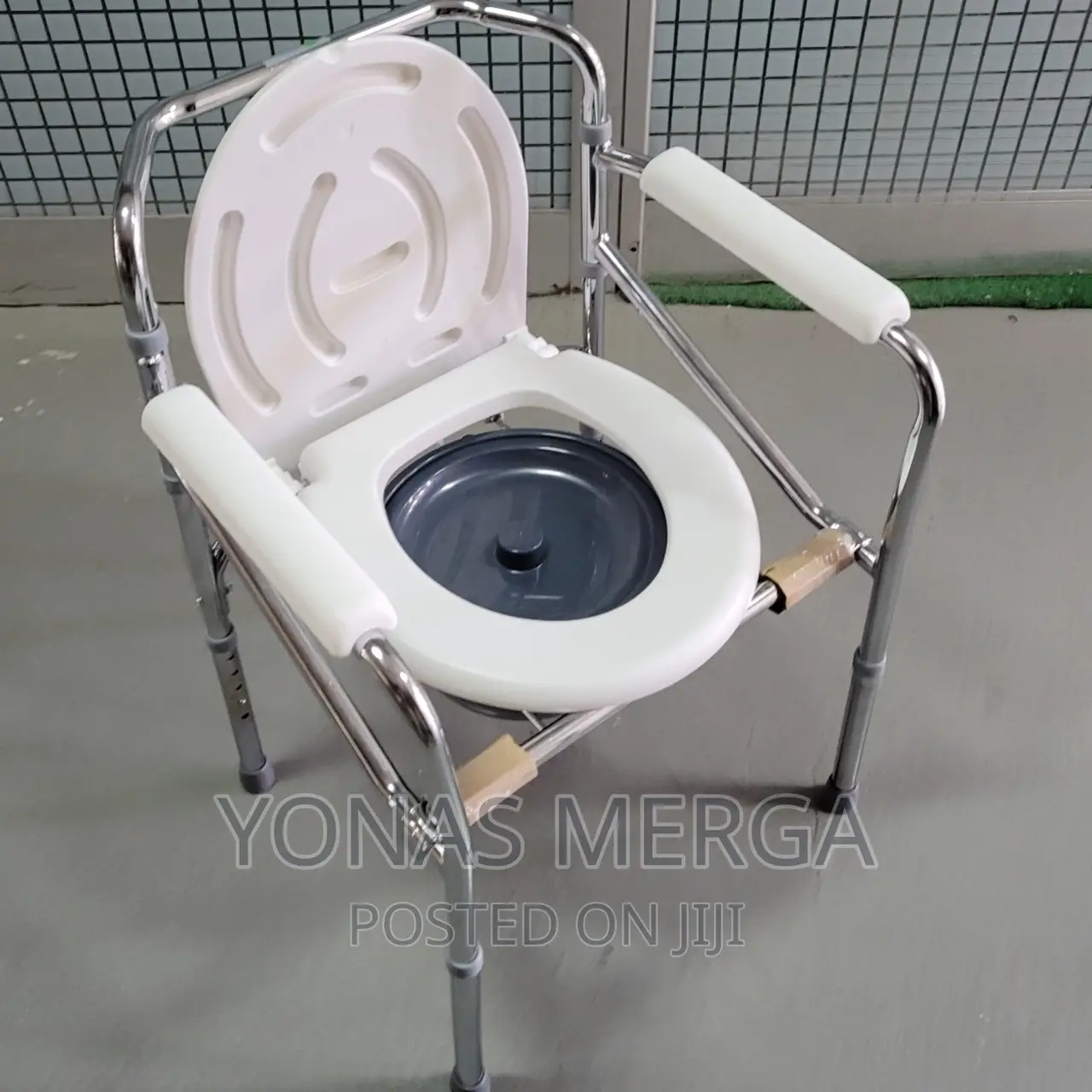Steel Drop Arm Bedside Commode With Padded Arms