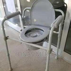 Photo - Swiftcomfort Adjustable Foldable Lightweight Toilet Chair"