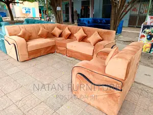 Photo - L-Shape Corner Sofa Made of Wooden Material.