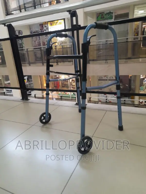 Used 2-Button Folding Walker With 5-Inch Wheels/Walker