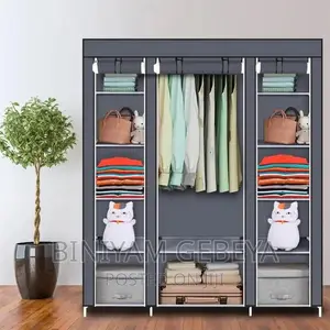 Photo - ባለ 3 ክፍል Clothes Storage Cabinat
