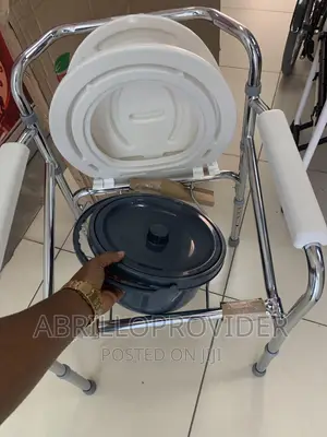 Photo - Adjustable Height Bedside or Over-the-Toilet Commode