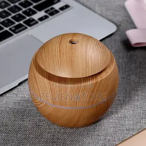 Photo - Mini Aroma Humidifier ቤትዎን በመልካም መዓዛ የሚያውድ