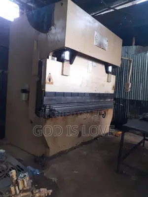 Photo - ላሜራ ማጠፍያ እና መቁረጫ Matal Banding and Shering Machine