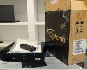 Photo - Brand New With Manual and Cartoon Optoma Projector