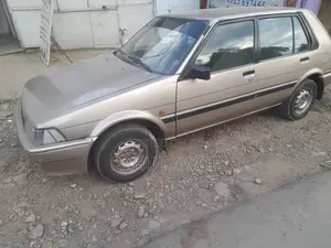 Photo - Toyota Corolla 1.3 1986 Gold