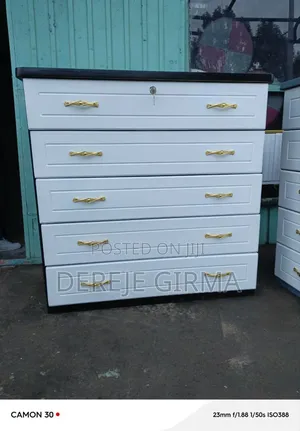 Photo - 1ሜትር ሸሚዝ ኮሞ