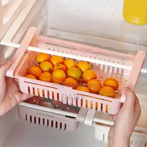 Photo - Expandable Plastic Space Saver Fridge Storage