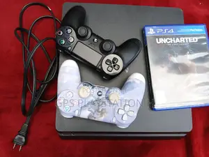 Photo - Playstation 4 Slim With Uncharted Cd
