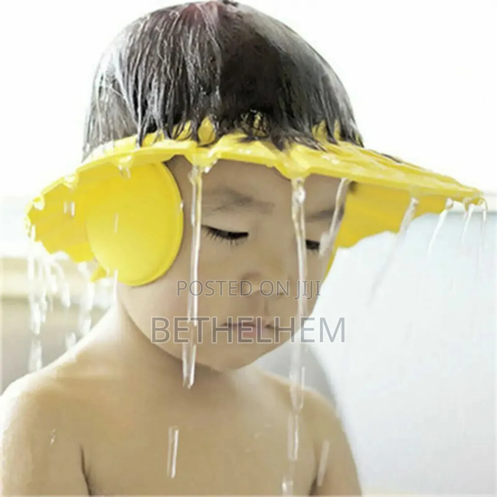 ልጆች ገላቸውን ሲታጠቡ ሻምፖ እና ውሀ አይናቸው እና ጆሮአቸው ውስጥ እንዳይገባ (ሻውር ኬፕ)