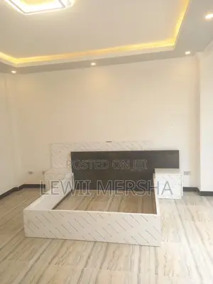 Photo - Bed With Side Table