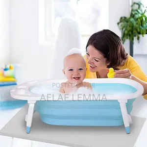 Photo - Folding Baby Bath + Bath Net