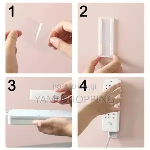 Photo - Wall-Mounted Power Strip Holder With a Power Strip Attached