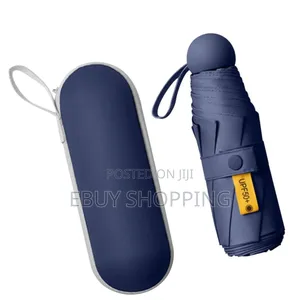 Photo - **Sun Rain Defense – Mini Folding Umbrella With Uv Block