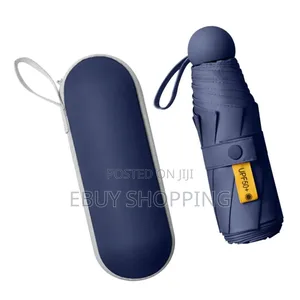 Photo - **Compact Travel Umbrella – Instant Sun Rain Shelter**