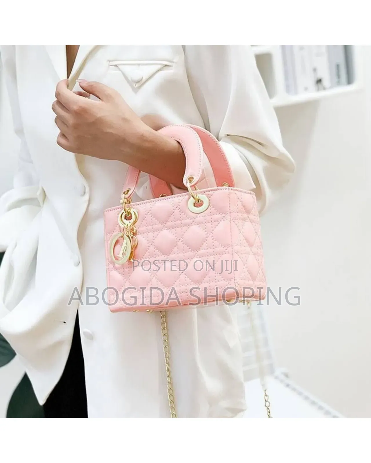 Elegant Designer Handbag With Gold Accents