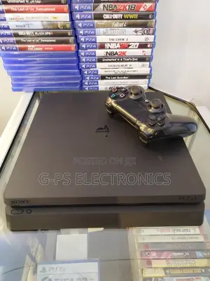 Photo - Playstation 4 Slim With 1 Joystick and Fc 24 Installed