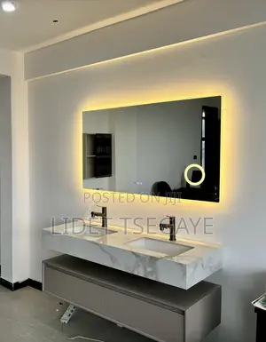 Photo - Fancy Toilet Sink With Cabinet And Mirror