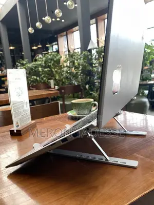 Photo - ለአይኖ የሚመች የአይን ከፍታ ላይ Pcዎን እንዲያስቀምጡ የሚረዳ Laptop Stand