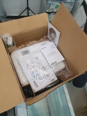 Photo - Epson Projector BRAND NEW With Cartoon Model Name: EB01