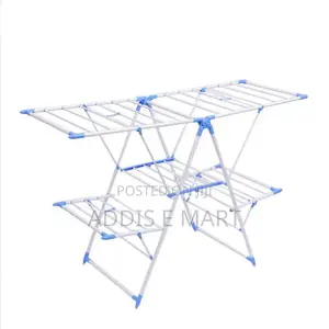 Photo - ቦታ ቆጣቢና በቀላሉ የሚተጣጠፉ 4 Wings Foldable Clothes Drying Rack