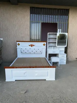 Photo - Bed and Dressing