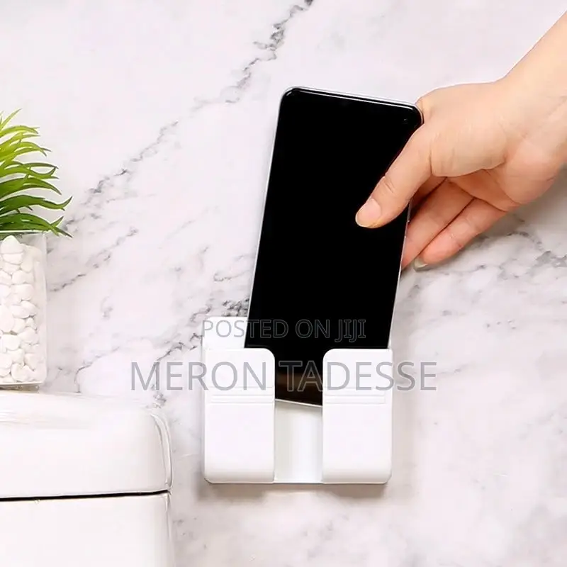 Keep Your Phone Charged With This Wall-Mounted Phone Rack.