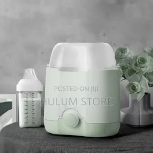 Photo -  ሁለት ጡጦወችን በአንድ ጊዜ ከነወተታቸው ያሞቃል