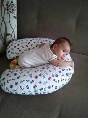 የማጥቢያ ደንገል Feeding Pillow