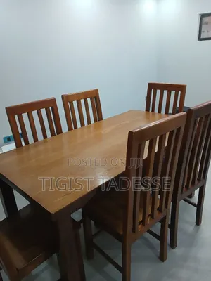 Photo - በዋንዛ የተሠራ የምግብ ጠረጴዛ ባለ 6 ወንበር 80*180ሳ.ሜ