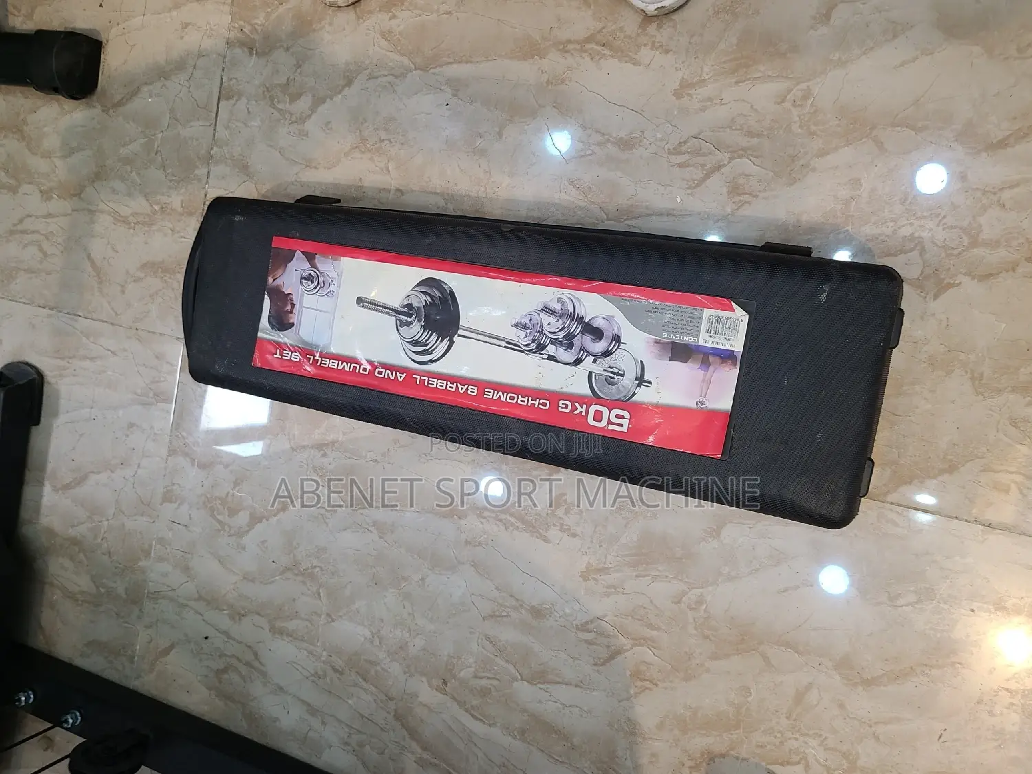 በቤቶ መኖር ያለበት ዘመናዊ ሁለገብ ዳምፔል እና ባርቤል