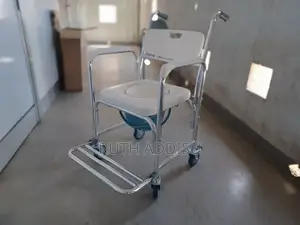 Photo - Commode With Mini Wheel Chair White Removable Popo Quality