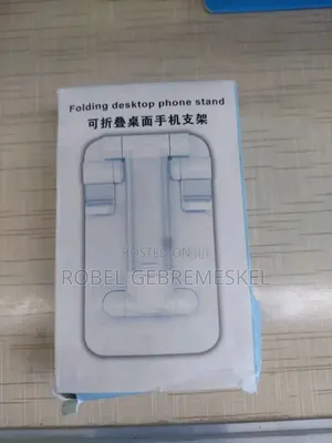 The Image Shows a White Folding Desktop Phone Stand