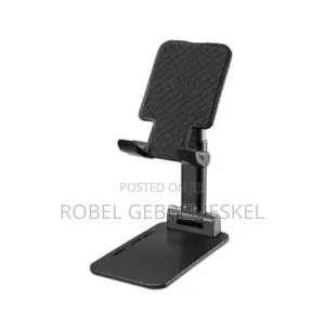 The Image Shows a White Folding Desktop Phone Stand